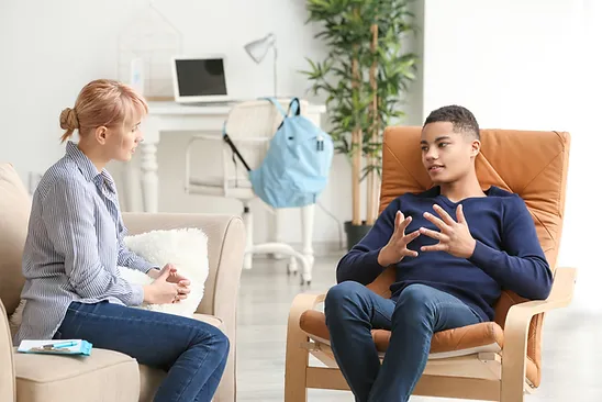 A psychotherapist listens to their client.